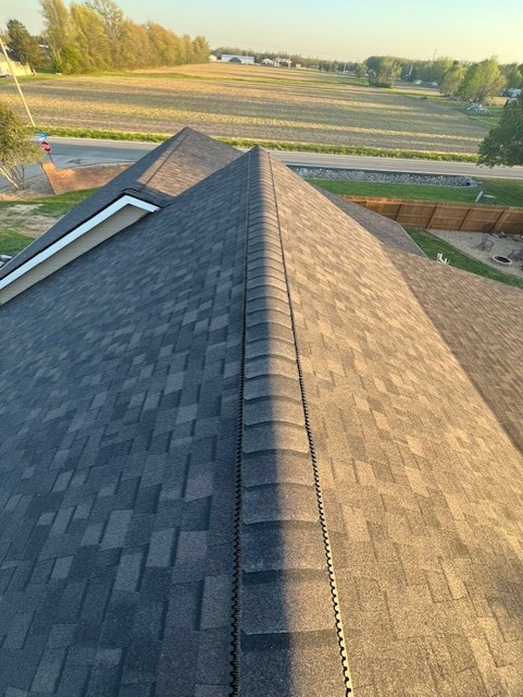 Ridge line of new asphalt shingle roof
